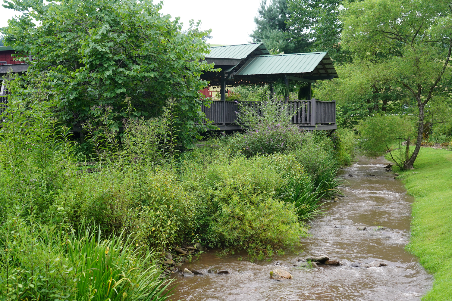 Creek flowing by a covered wedding pavilion in the mountains of Pigeon Forge