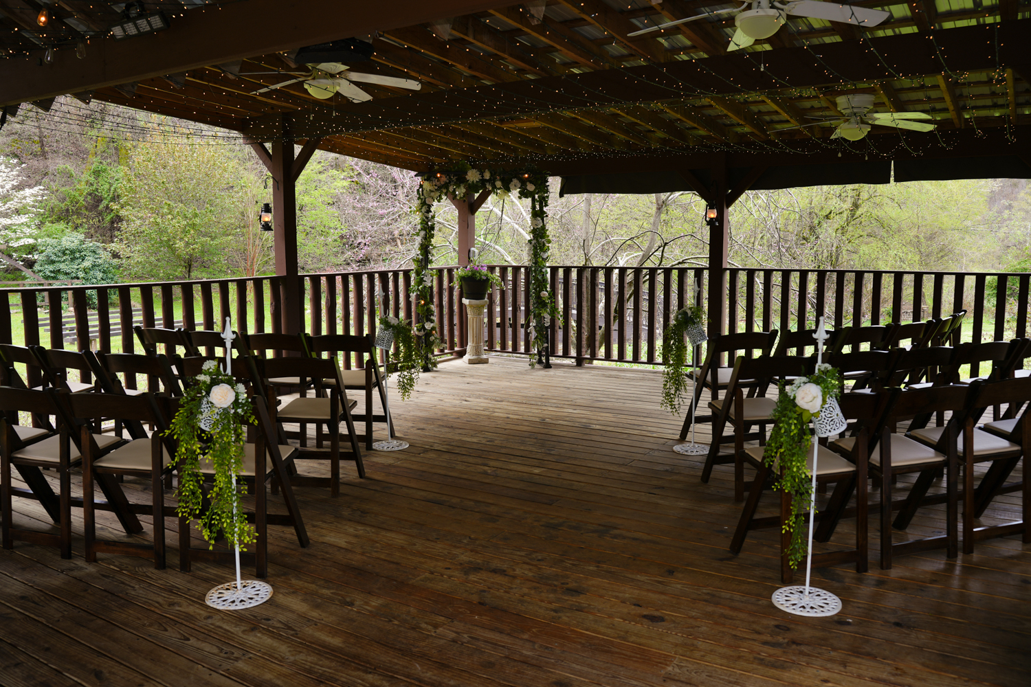 Covered pavilion with dark brown wedding chairs