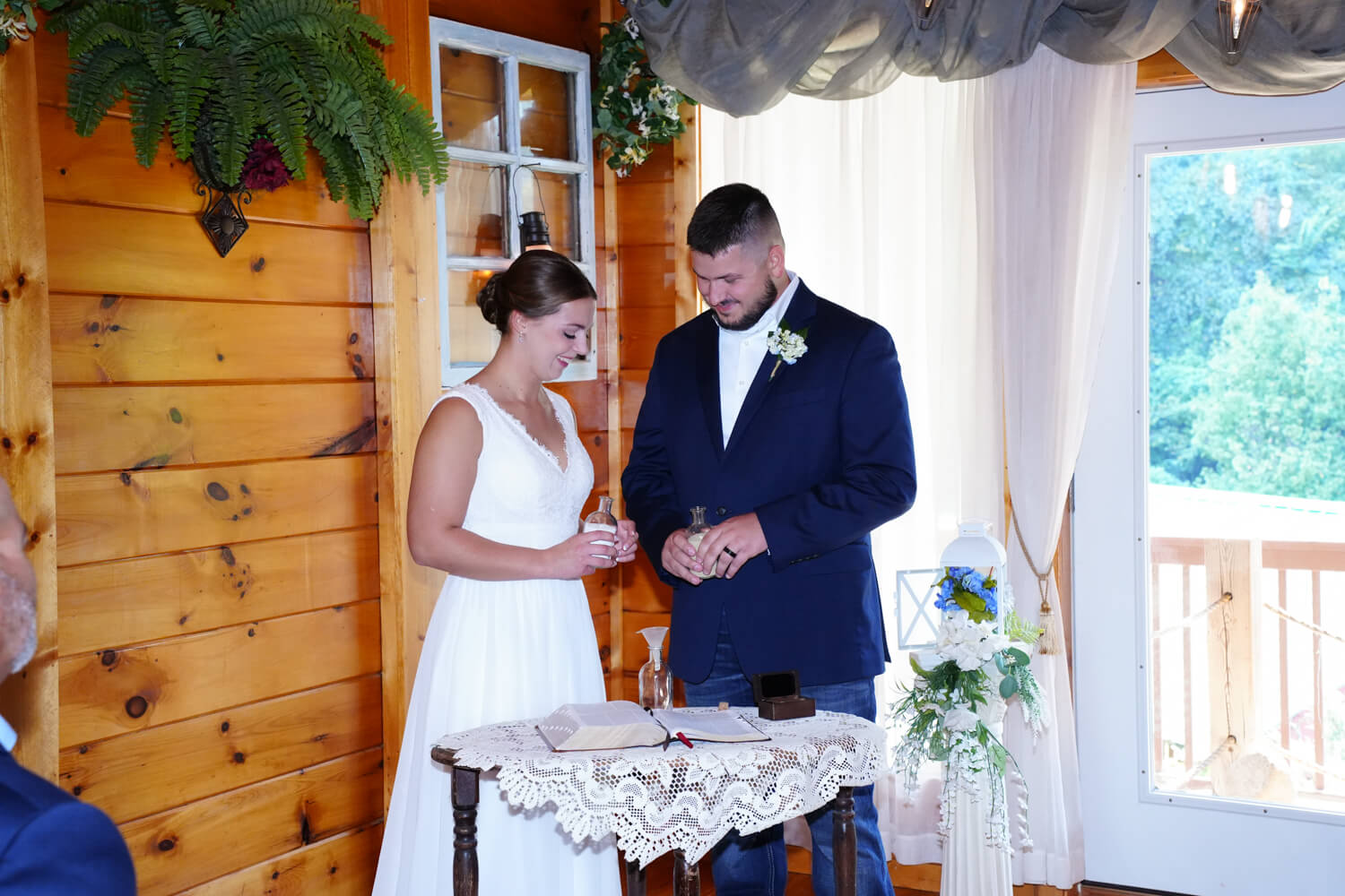 Bride and Groom performing a sand unity ceremony in a wedding chapel in Pigeon Forge Tennessee