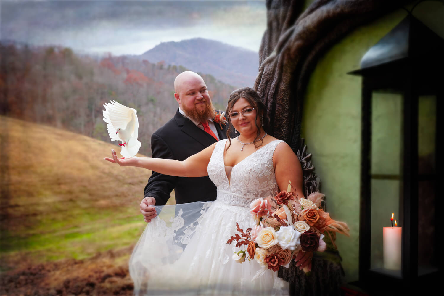 Fantasy image of wedding couple at a fairy house in the mountains with a candle burning by the door and a white dove flying into her hand