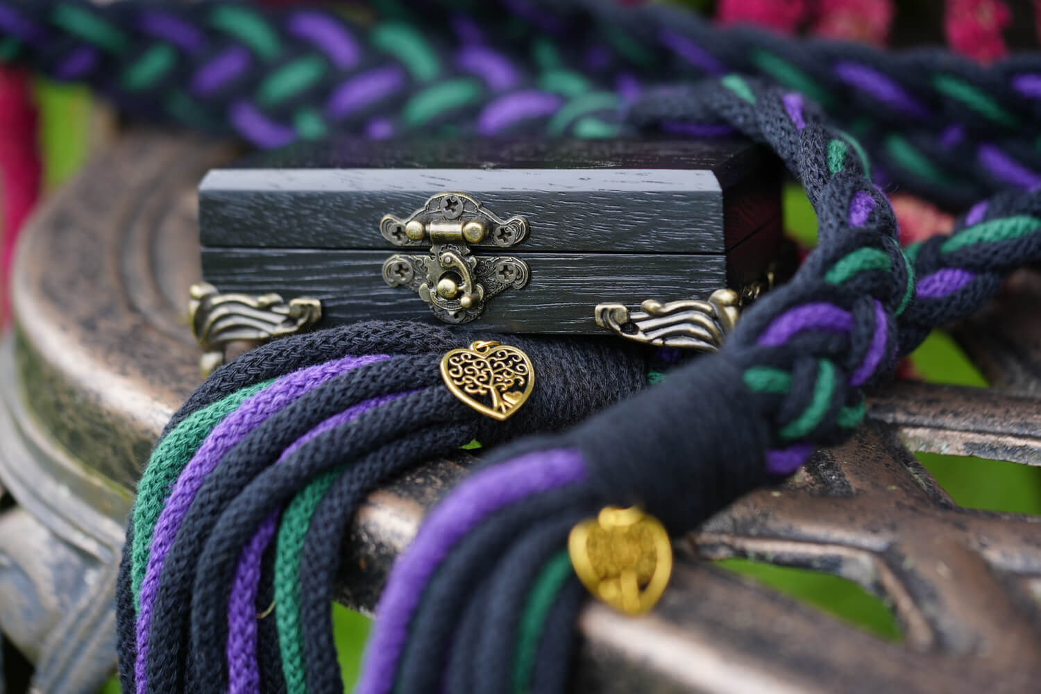 black, purple and green hand fasting ropes with a black ring box