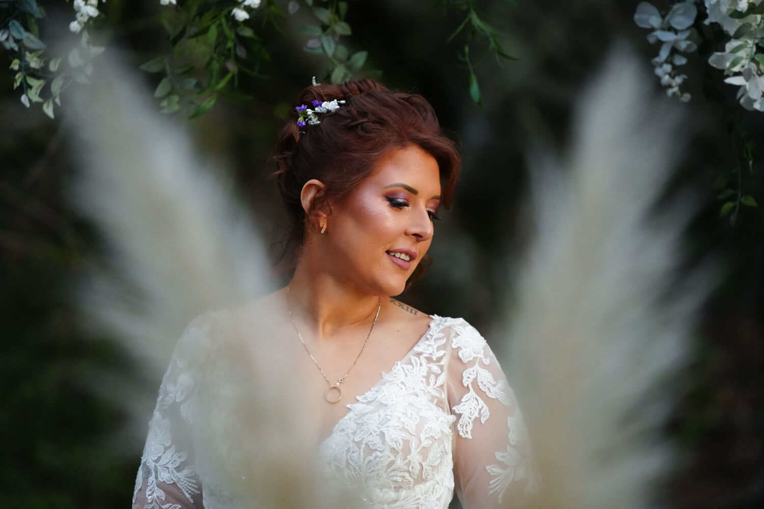 Bridal portrait with feathery pampass grasses in the foreground