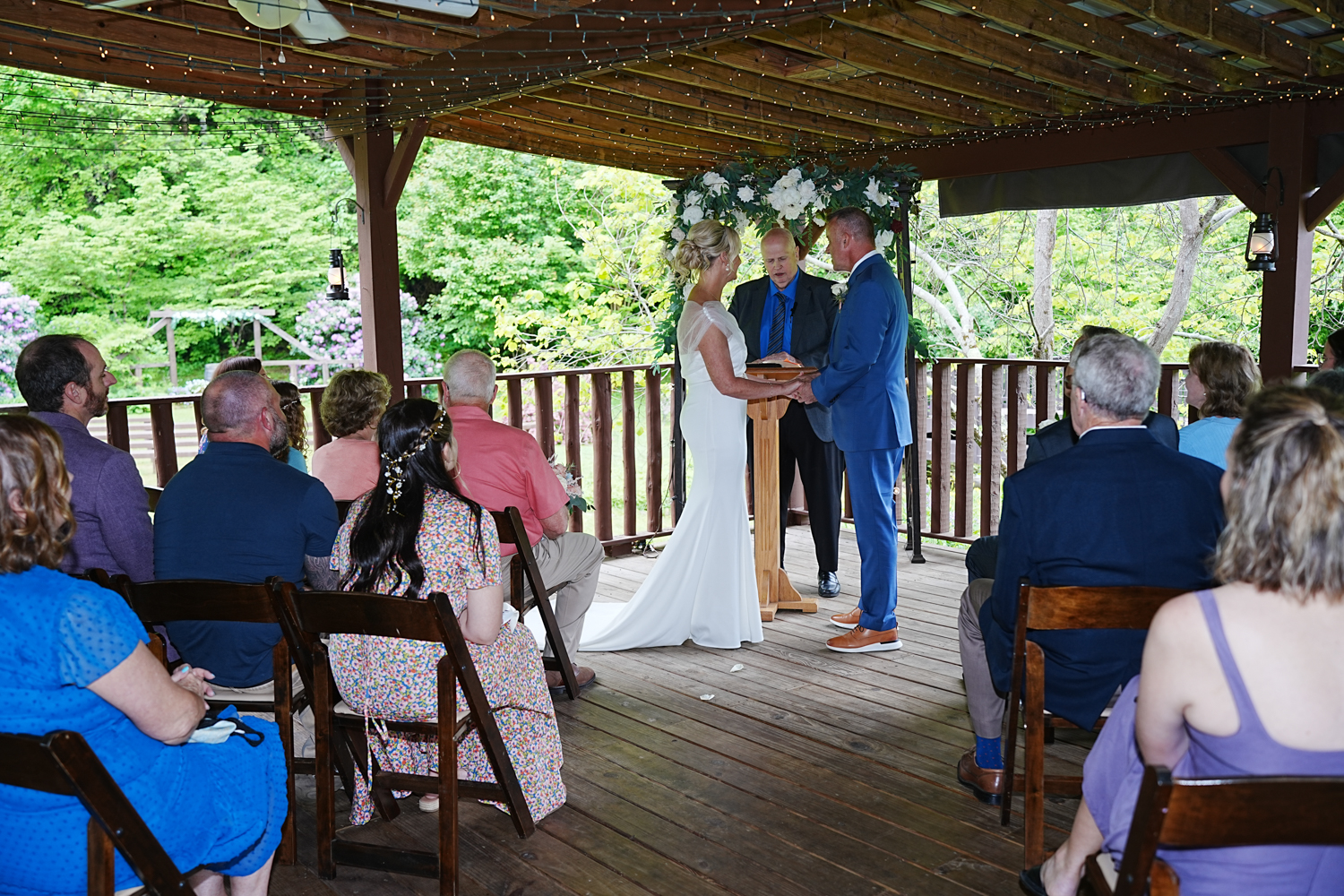 Wedding ceremony under a covered pavilion in the spring