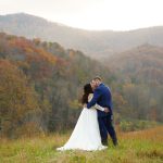 All-InclusiveWeddingVenue: Bride and groom enjoying a kiss privately at the mountain adventure site at Honeysuckle Hills in Pigeon Forge by one of their recommended photographers