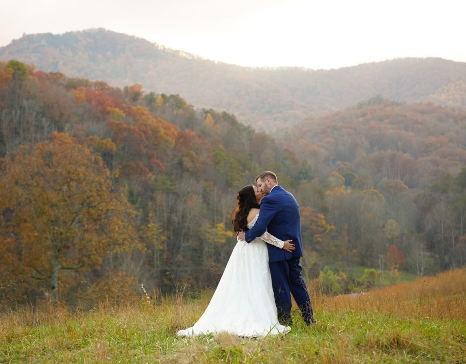 All-InclusiveWeddingVenue: Bride and groom enjoying a kiss privately at the mountain adventure site at Honeysuckle Hills in Pigeon Forge by one of their recommended photographers