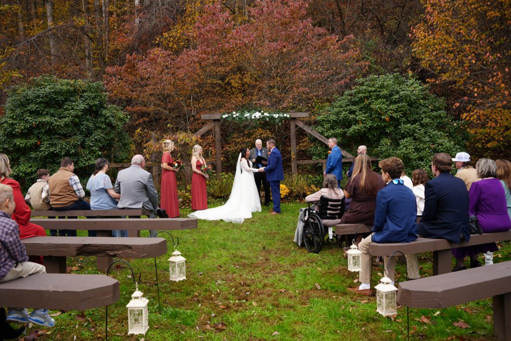 Peak fall wedding color during a woodland ceremony at Honeysuckle Hills in the Smoky Mountains